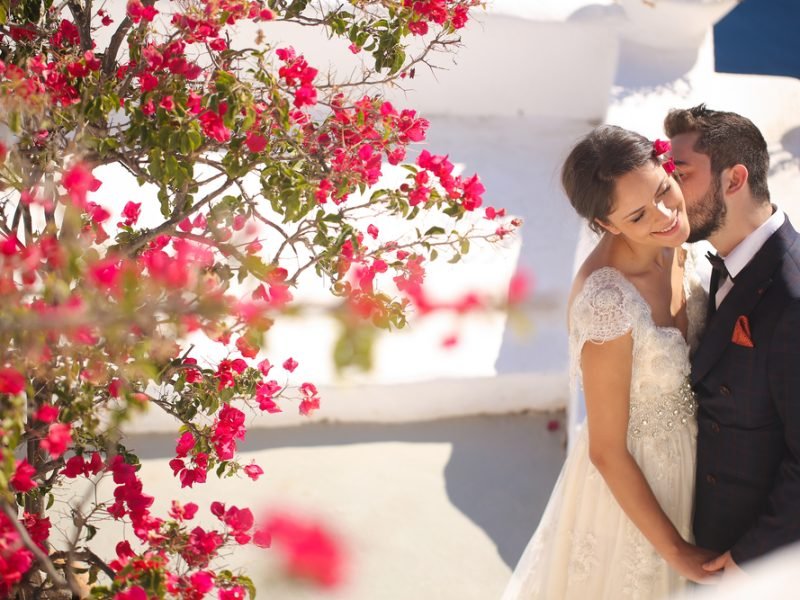 Groom,And,Bride,On,The,Roof,Of,A,House,In